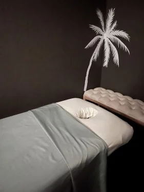 A calm, low-lit private treatment room at The WaterCube Spa
